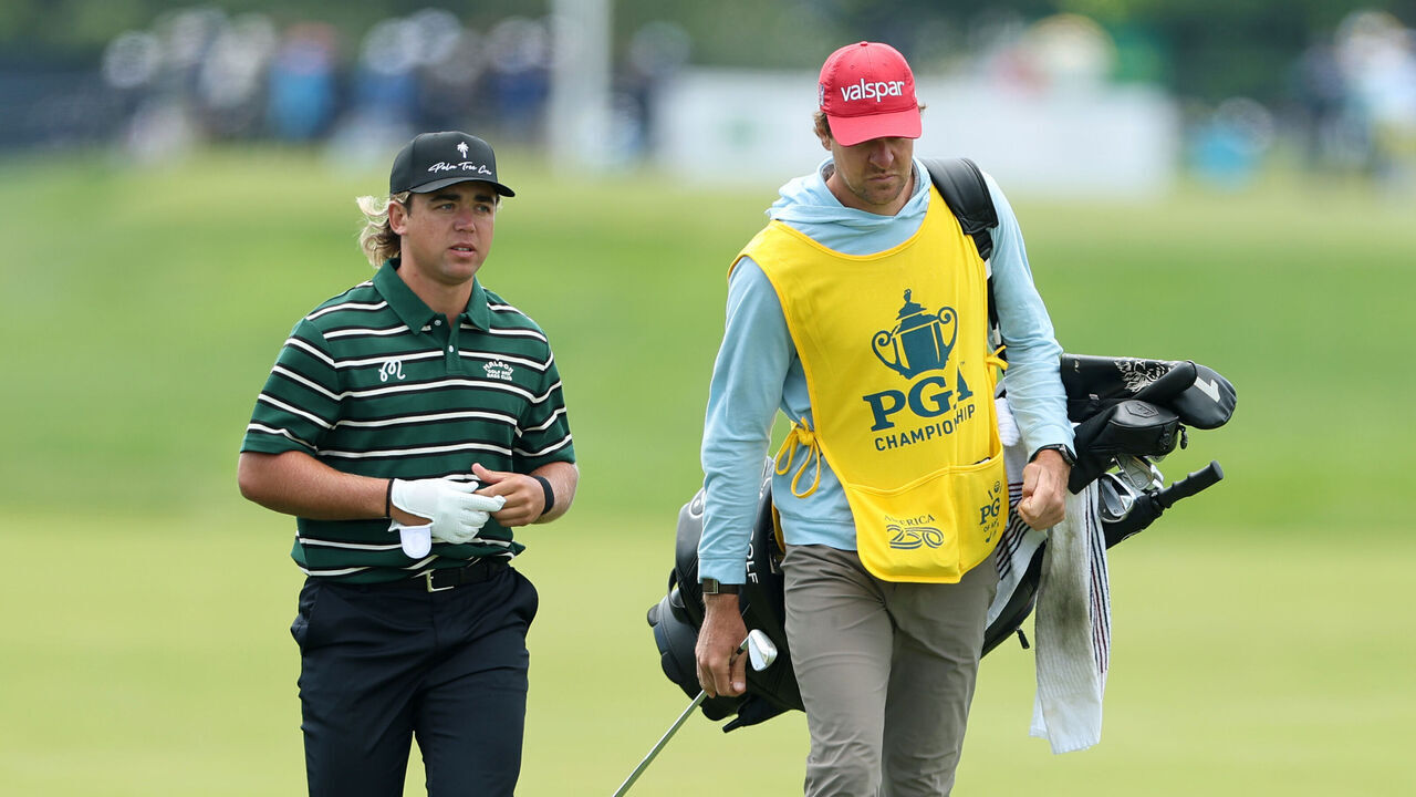 NEWTOWN, PENNSYLVANIA - MAY 14: Garrick Higgo of South Africa walks the 16th hole alongside caddie Austin Gaugert during the first round of the PGA Championship at Aronimink Golf Club on May 14, 2026 in Newtown, Pennsylvania.