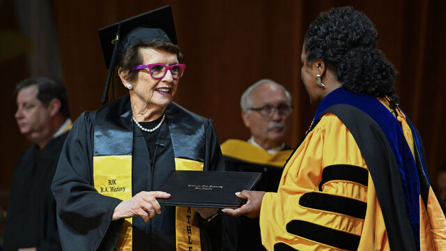 Los Angeles, CA - May 18: Billie Jean King receives her Bachelor of Arts in History diploma from Cal State Los Angeles president Berenecea Johnson Eanes during the commencement ceremony for their College of Natural and Social Sciences at the Shrine Auditorium in Los Angeles, CA, on Monday, May 18, 2026. At 82, tennis icon Billie Jean King received her degree more than 60 years after beginning her studies, She also delivered the keynote address during ceremony.
