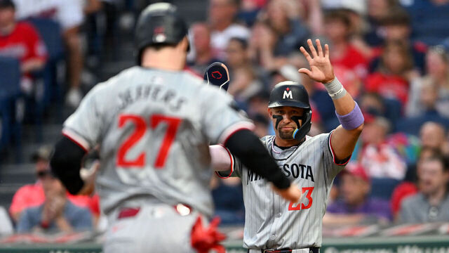 CLEVELAND, OHIO - SEPTEMBER 16, 2024: Royce Lewis #23 and Ryan Jeffers #27 of the Minnesota Twins celebrate scoring on a single hit by Byron Buxton during the third inning against the Cleveland Guardians at Progressive Field on September 16, 2024 in Cleveland, Ohio.