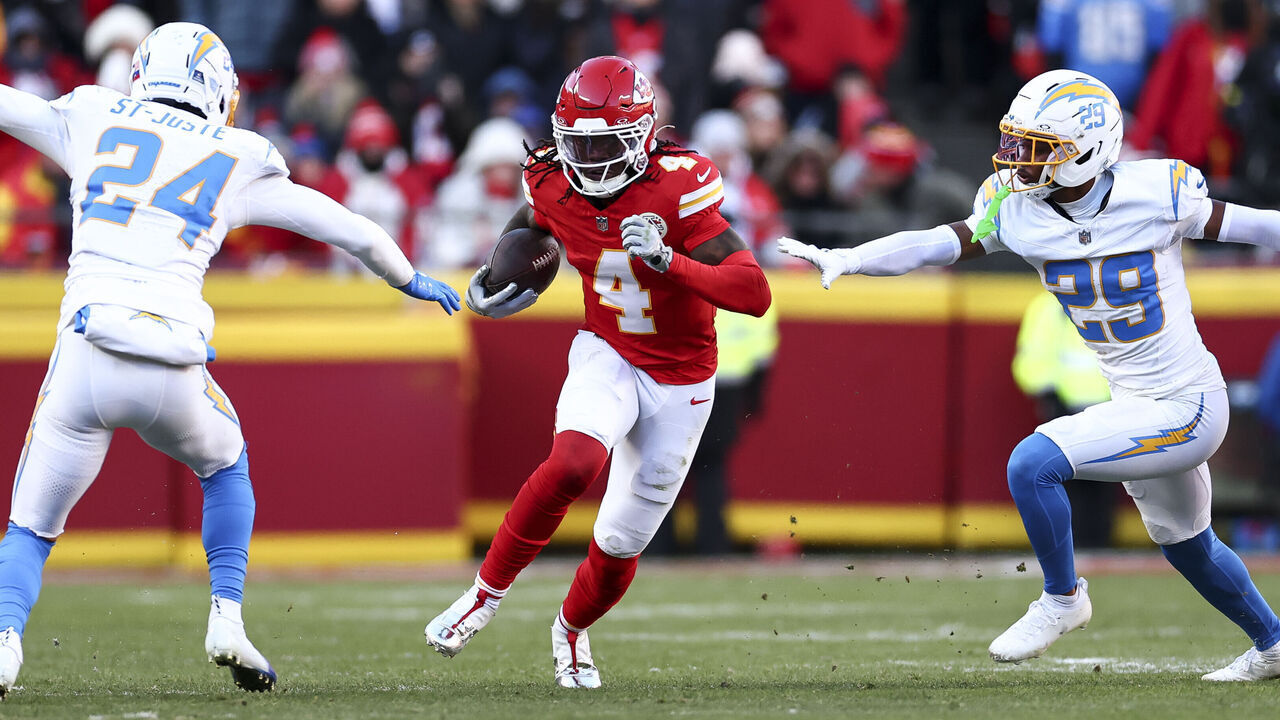 KANSAS CITY, MISSOURI - DECEMBER 14: Rashee Rice #4 of the Kansas City Chiefs runs with the ball during the fourth quarter of the NFL football game against the Los Angeles Chargers at GEHA Field at Arrowhead Stadium on December 14, 2025 in Kansas City, Missouri.