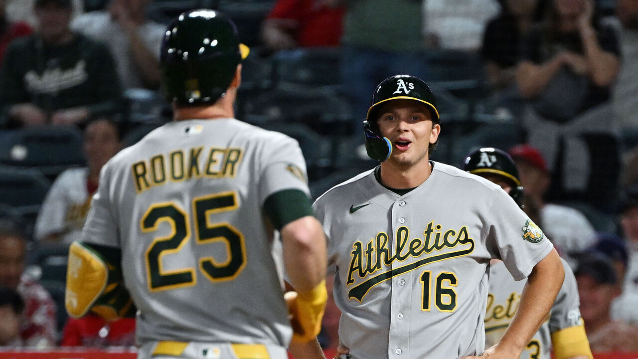 ANAHEIM, CA - MAY 19: Athletics first baseman Nick Kurtz (16) waits at home plate for right fielder Brent Rooker (25) after Rooker hit a two run home run during an MLB baseball game against the Los Angeles Angels played on May 19, 2026 at Angel Stadium in Anaheim, CA.