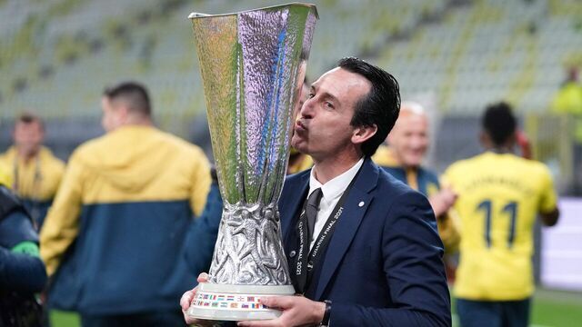 Villarreal's Spanish coach Unai Emery poses for pictures with the trophy after winning the UEFA Europa League final football match between Villarreal CF and Manchester United at the Gdansk Stadium in Gdansk on May 26, 2021.