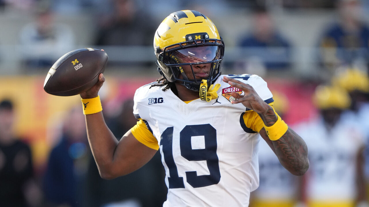 ORLANDO, FL - DECEMBER 31: Michigan Wolverines quarterback Bryce Underwood (19) makes a pass attempt during the Cheez-It Bowl between the Michigan Wolverines and the Texas Longhorns on Wednesday, December 31, 2025 at Camping World Stadium in Orlando, FL