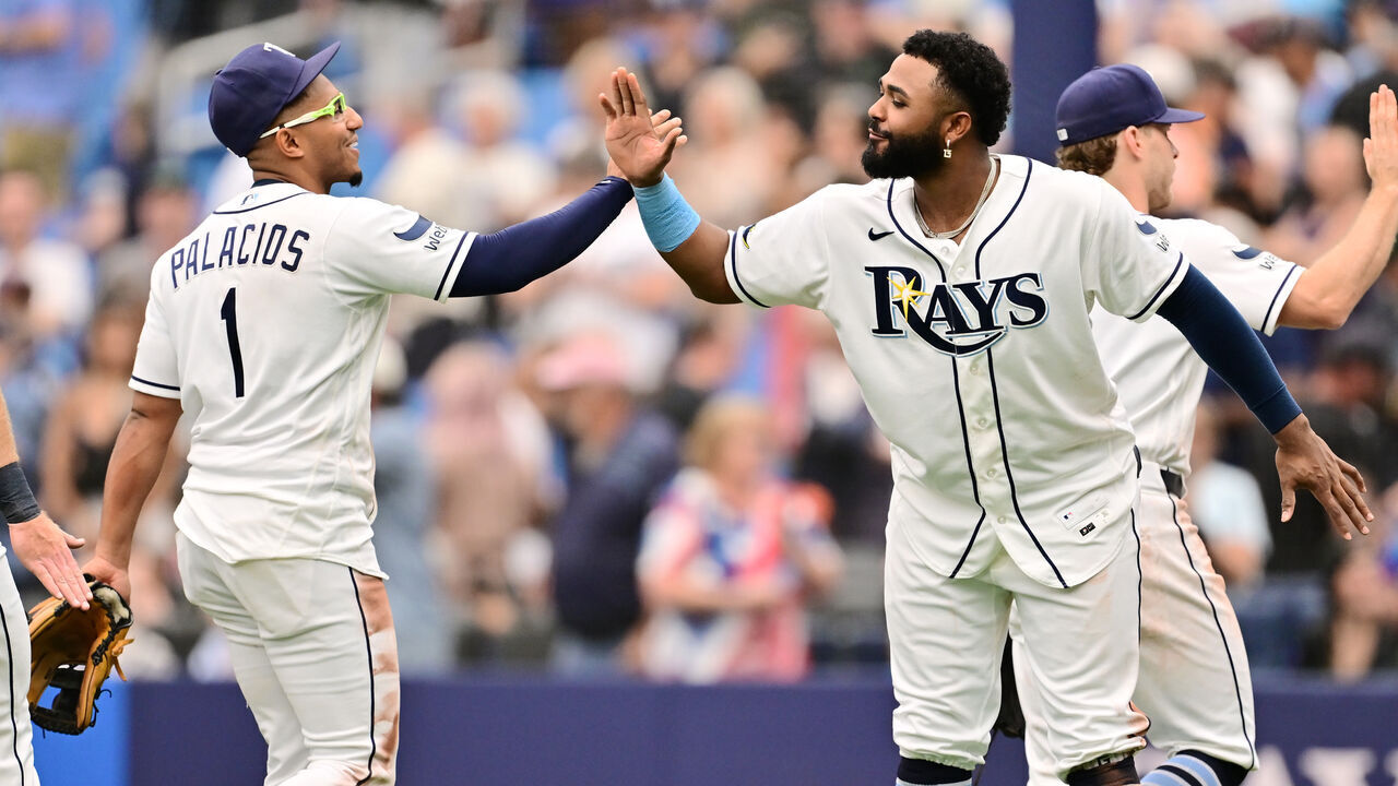 ST PETERSBURG, FLORIDA - MAY 20: Junior Caminero #13 celebrates with Richie Palacios #1 of the Tampa Bay Rays after defeating the Baltimore Orioles 5-3 at Tropicana Field on May 20, 2026 in St Petersburg, Florida.