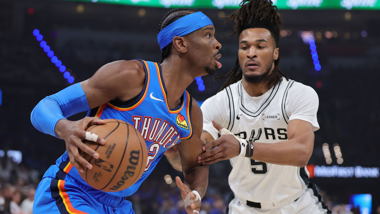 OKLAHOMA CITY, OKLAHOMA - MAY 20: Shai Gilgeous-Alexander #2 of the Oklahoma City Thunder drives around Stephon Castle #5 of the San Antonio Spurs during the first quarter in Game Two of the NBA Western Conference Finals at Paycom Center on May 20, 2026 in Oklahoma City, Oklahoma.