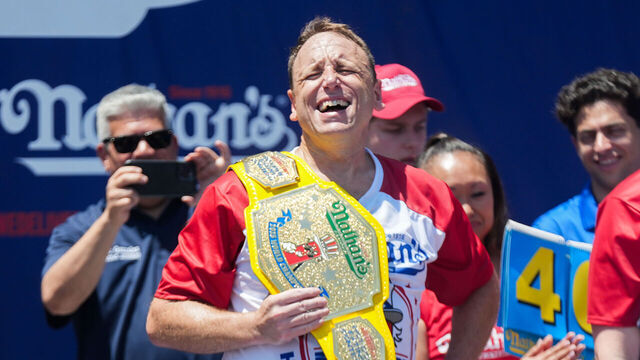 NEW YORK, UNITED STATES - JULY 04: Joey Chestnut wins the men's division at the 2025 Nathan's Famous International Hot Dog Eating Contest held in New York, United States on July 04, 2025. Chestnut consumed 70 hot dogs and buns in the 10-minute competition marking his 17th victory in the event.
