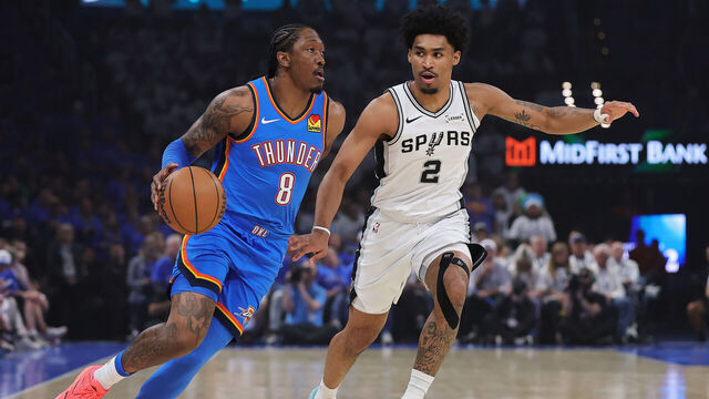 OKLAHOMA CITY, OKLAHOMA - MAY 20: Jalen Williams #8 of the Oklahoma City Thunder drives around Dylan Harper #2 of the San Antonio Spurs during the first quarter in Game Two of the NBA Western Conference Finals at Paycom Center on May 20, 2026 in Oklahoma City, Oklahoma.