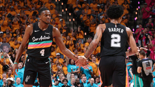SAN ANTONIO, TX - MAY 4: De'Aaron Fox #4 & Dylan Harper #2 of the San Antonio Spurs high five during the game against the Minnesota Timberwolves during Round Two Game One of the 2026 NBA Playoffs on May 4, 2026 at the Frost Bank Center in San Antonio, Texas. Mandatory Copyright Notice: Copyright 2026 NBAE (Photos by Joe Murphy/NBAE via Getty Images)
