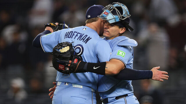 NEW YORK, NEW YORK - MAY 21: Jeff Hoffman #23 and Brandon Valenzuela #59 of the Toronto Blue Jays celebrate after the ninth inning against the New York Yankees at Yankee Stadium on May 21, 2026 in the Bronx borough of New York City. The Toronto Blue Jays won 2-0.