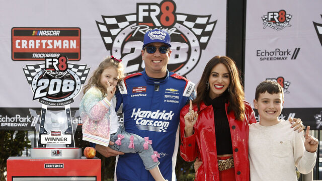 HAMPTON, GEORGIA - FEBRUARY 21: Kyle Busch, driver of the #7 HendrickCars.com Chevrolet, celebrates with daughter, Lennix Busch son, Brexton Busch and wife, Samantha Busch in victory lane after winning the NASCAR Craftsman Truck Series Fr8 Racing 208 at Echo Park Speedway on February 21, 2026 in Hampton, Georgia.