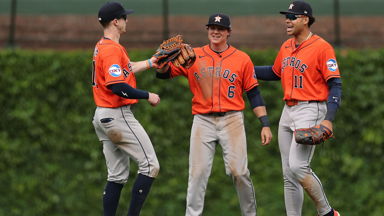 CHICAGO, ILLINOIS - MAY 22: Zach Cole #16, Jake Meyers #6 and Cam Smith #11 of the Houston Astros celebrate after defeating the Chicago Cubs at Wrigley Field on May 22, 2026 in Chicago, Illinois.