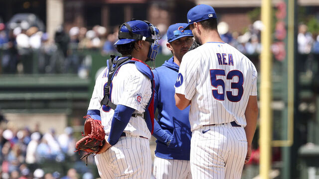 CHICAGO, ILLINOIS - MAY 23: Colin Rea #53, Miguel Amaya #9 and pitching coach Tommy Hottovy #68 of the Chicago Cubs meet on the mound during the fourth inning against the Houston Astros at Wrigley Field on May 23, 2026 in Chicago, Illinois.