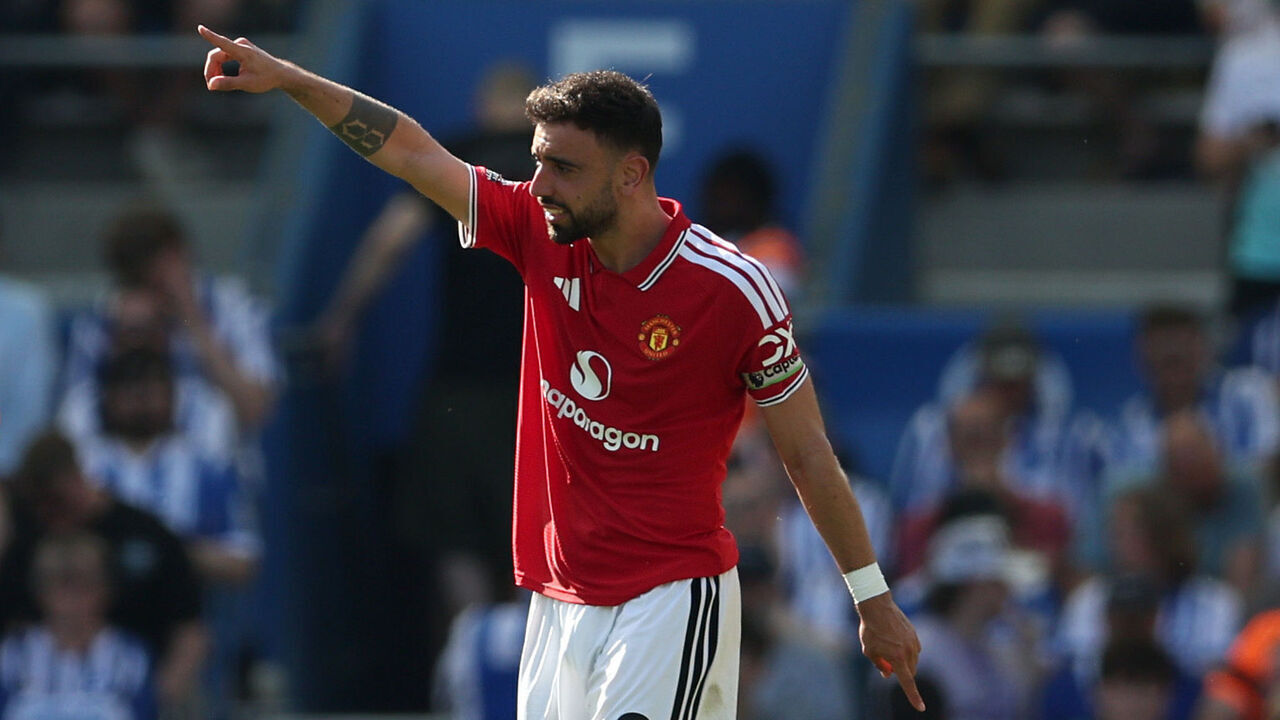 BRIGHTON, ENGLAND - MAY 24: Bruno Fernandes of Manchester United celebrates as teammate Patrick Dorgu scores his team's first goal during the Premier League match between Brighton & Hove Albion and Manchester United at the Amex Stadium on May 24, 2026 in Brighton, England.