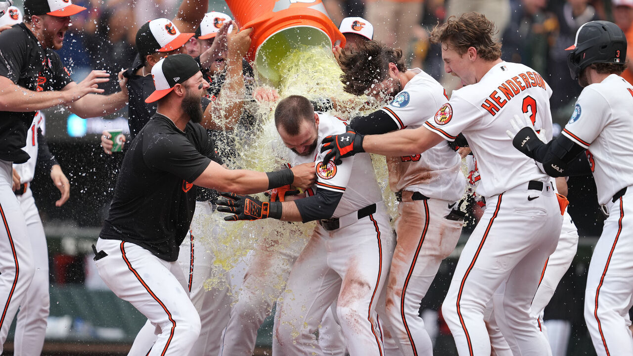 BALTIMORE, MD - MAY 25: Colton Cowser #17 of the Baltimore Orioles celebrates hitting the game-winning two-run home run in the 13th inning inning with teammates during the baseball game against the Tampa Bay Rays at Oriole Park at Camden Yards on May 25, 2026 in Baltimore, Maryland.