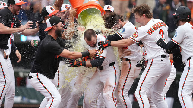 BALTIMORE, MD - MAY 25: Colton Cowser #17 of the Baltimore Orioles celebrates hitting the game-winning two-run home run in the 13th inning inning with teammates during the baseball game against the Tampa Bay Rays at Oriole Park at Camden Yards on May 25, 2026 in Baltimore, Maryland.