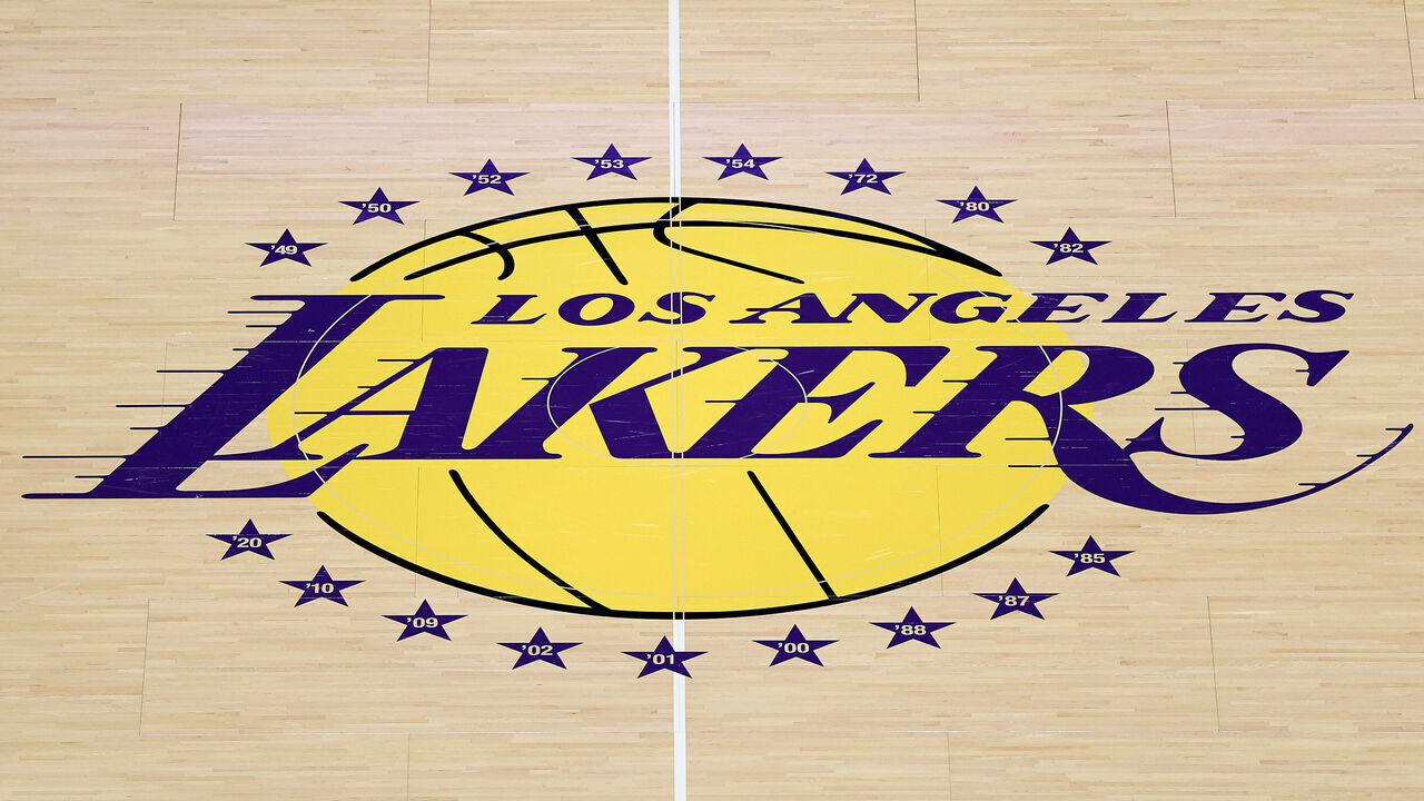 LOS ANGELES, CALIFORNIA - OCTOBER 21: A detailed view of a Los Angeles Lakers logo on the court before the game against the Golden State Warriors at Crypto.com Arena on October 21, 2025 in Los Angeles, California.