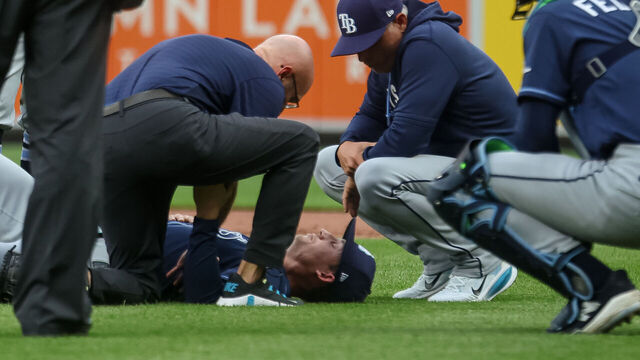BALTIMORE, MD - MAY 26: Griffin Jax #22 of the Tampa Bay Rays receives attention on the field after taking a batted ball to the back during the second inning against the Baltimore Orioles at Oriole Park at Camden Yards on May 26, 2026 in Baltimore, Maryland.