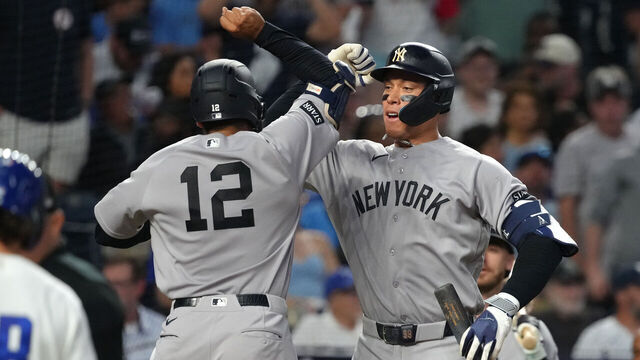 KANSAS CITY, MISSOURI - MAY 26: Trent Grisham #12 of the New York Yankees celebrates his home run with Aaron Judge #99 of the New York Yankees in the seventh inning against the Kansas City Royals at Kauffman Stadium on May 26, 2026 in Kansas City, Missouri.