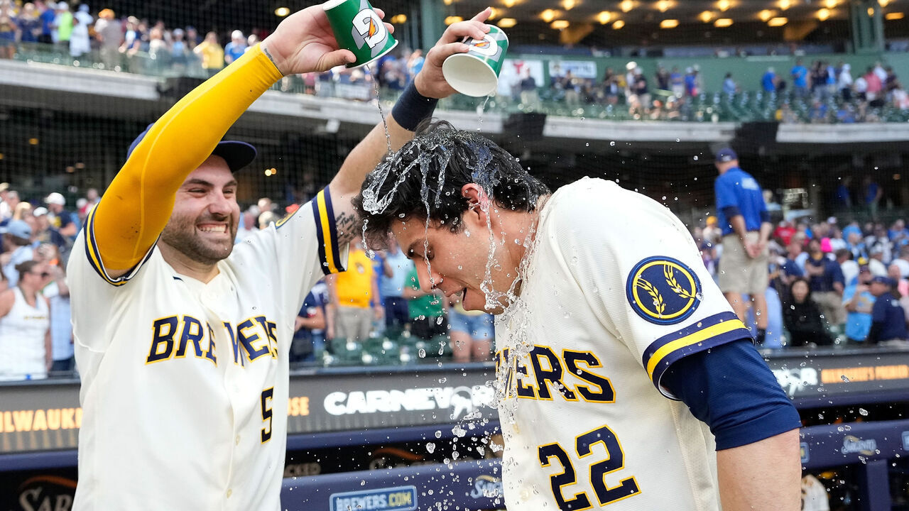 MILWAUKEE, WISCONSIN - MAY 27: Garrett Mitchell #5 dumps water on Christian Yelich #22 of the Milwaukee Brewers after a 2-1 win over St. Louis Cardinals at American Family Field on May 27, 2026 in Milwaukee, Wisconsin.