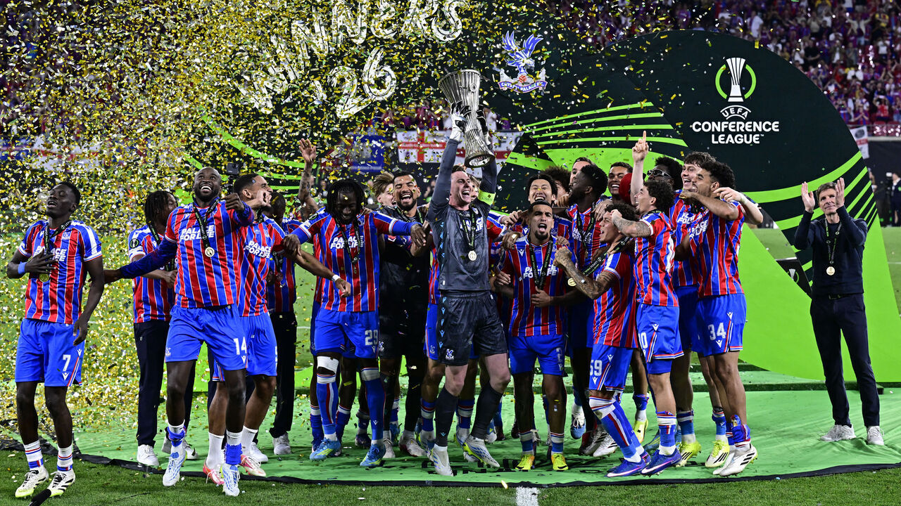 Team Crystal Palace FC celebrates with the trophy after winning the UEFA Conference League final football match between Crystal Palace FC and Rayo Vallecano de Madrid in Leipzig, eastern Germany, on May 27, 2026.