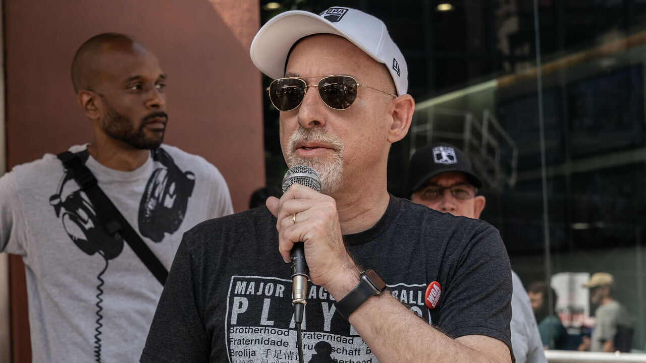 NEW YORK, UNITED STATES - 2023/07/26: Deputy Executive Director at Major League Baseball Players Association Bruce Meyer speaks as striking members of Writers Guild of America picketing in front of CBS Broadcast Center on theme Sport Writers Picket. Executives from NHL Players Association, NFL Players Association, MLB Players Association joined and spoke during picket.