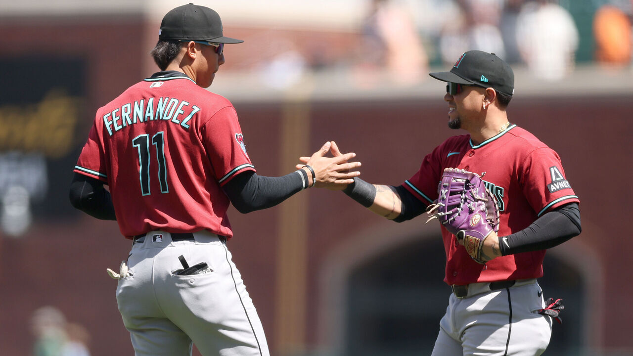 SAN FRANCISCO, CALIFORNIA - MAY 27: Jose Fernandez #11 and Geraldo Perdomo #2 of the Arizona Diamondbacks shake hands after they beat the San Francisco Giants at Oracle Park on May 27, 2026 in San Francisco, California.