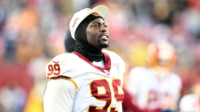LANDOVER, MARYLAND - DECEMBER 25: Javon Kinlaw #99 of the Washington Commanders watches the game against the Dallas Cowboys at Northwest Stadium on December 25, 2025 in Landover, Maryland.