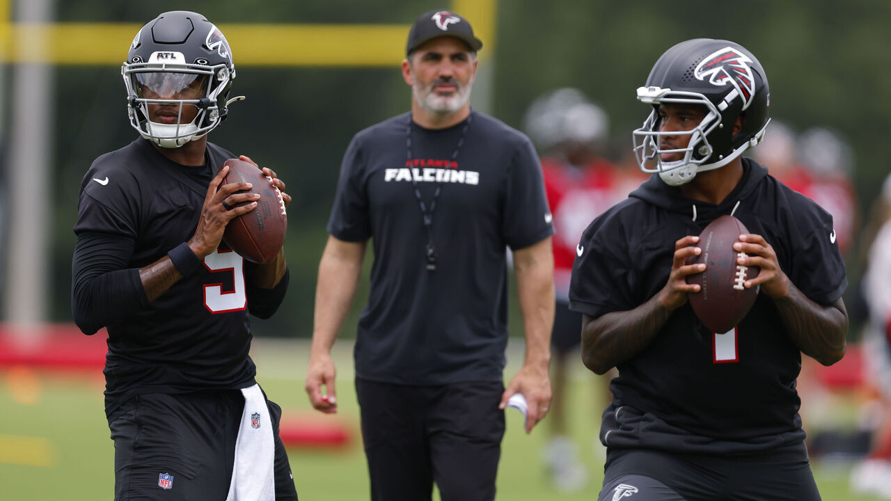FLOWERY BRANCH, GEORGIA - MAY 27: Michael Penix Jr. #9 of the Atlanta Falcons runs through drills alongside Tua Tagovailoa #1 as head coach Kevin Stefanski looks on during OTA's at IBM Performance Field on May 27, 2026 in Flowery Branch, Georgia.