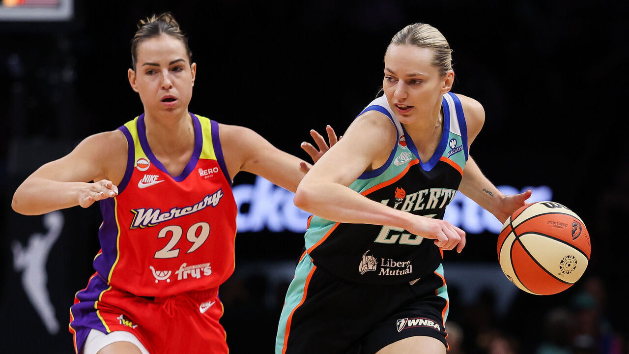 NEW YORK, NEW YORK - MAY 27: Marine Johannes #23 of the New York Liberty drives against Jovana Nogic #29 of the Phoenix Mercury during the first quarter at Barclays Center on May 27, 2026 in the Brooklyn borough of New York City.