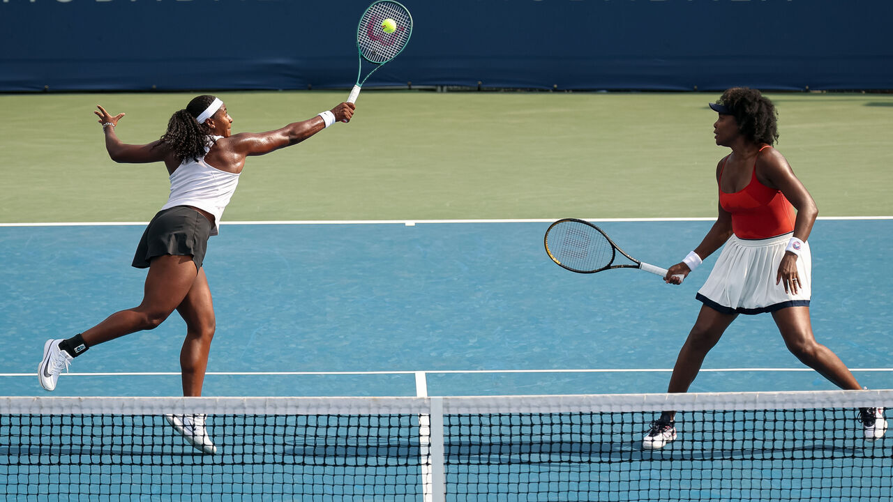 WASHINGTON, DC - JULY 23: Hailey Baptiste (L) and Venus Williams in action against Shuai Zhang and Taylor Townsend during a women's doubles match on day 3 of the Mubadala Citi DC Open 2025 at William H.G. FitzGerald Tennis Center on July 23, 2025 in Washington, DC.