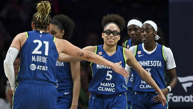 MINNEAPOLIS, MN. - MAY 2026: Minnesota Lynx guard Olivia Miles (5) high fives guard Kayla McBride (21) after an and-one opportunity created by Miles in the first half against the Toronto Tempo Thursday, May 21, 2026 at Target Center in Minneapolis, Minn. Minnesota Lynx vs. Toronto Tempo, WNBA game.