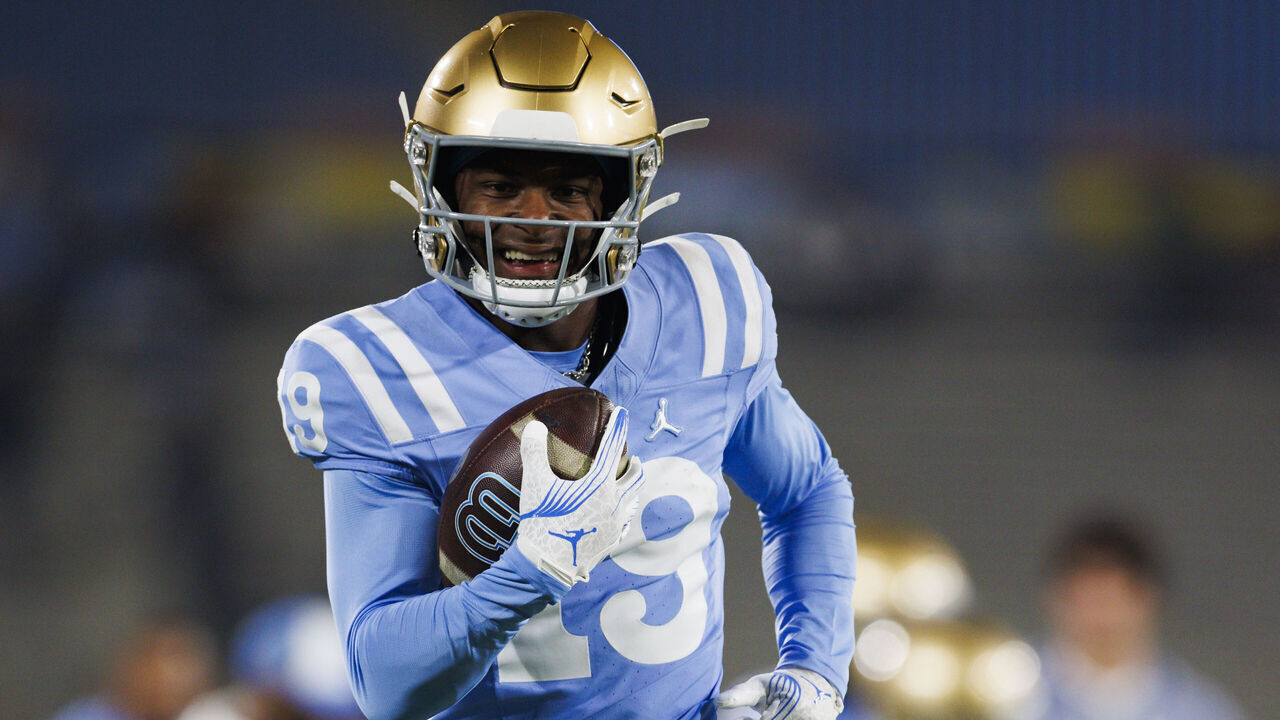 PASADENA, CALIFORNIA - NOVEMBER 8: Karson Gordon #19 of the UCLA Bruins runs after the catch before a game against Iowa Hawkeyes at Rose Bowl Stadium on November 8, 2024 in Pasadena, California.
