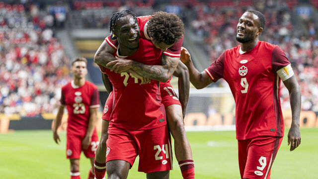 VANCOUVER, CANADA - JUNE 17: Promise David #24 of Canada celebrates with teammates Tajon Buchanan #17 and Cyle Larin #9 after scoring a goal against Honduras during the second half of 2025 Concacaf Gold Cup Group B action at BC Place on June 17, 2025 in Vancouver, Canada.