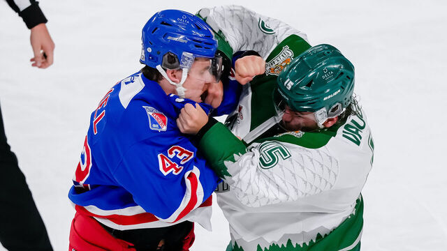KELOWNA, CANADA - MAY 25: Andrew MacNiel #43 of the Kitchener Rangers fights with Jaxsin Vaughan #15 of the Everett Silvertips during the second period of their 2026 Memorial Cup game at Prospera Place on May 25, 2026 in Kelowna, British Columbia, Canada.