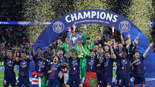 Paris Saint-Germain's Brazilian defender #05 Marquinhos (C) lifts the trophy as he celebrates with teammates winning the UEFA Champions League final football match between Paris Saint-Germain (PSG) and Arsenal FC at the Puskas Arena in Budapest on May 30, 2026.