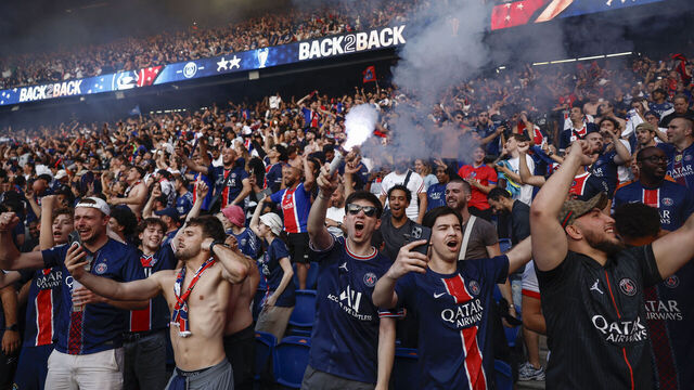 PSG supporters who watched on a giant screen the UEFA Champions League final between Paris Saint-Germain (PSG) and Arsenal FC played in Budapest, celebrate after PSG won, at the Parc des Princes stadium, in Paris on May 30, 2026.