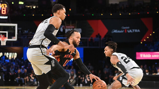 LAS VEGAS, NV - DECEMBER 16: Jalen Brunson #11 of the New York Knicks dribbles the ball as Victor Wembanyama #1 of the San Antonio Spurs plays defense during the game during the 2025 NBA Emirates Cup Final on December 16, 2025 at T-Mobile Arena in Las Vegas, Nevada. Mandatory Copyright Notice: Copyright 2025 NBAE