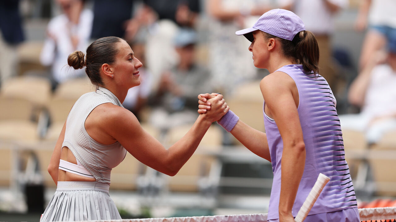 PARIS, FRANCE - MAY 31:Marta Kostyuk of Ukraine (L) and Iga Swiatek of Poland (R) shake hands after their Women's Singles fourth round match on Day Eight of the 2026 French Open at Roland Garros on May 31, 2026 in Paris, France.
