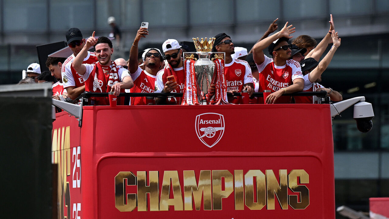 ISLINGTON, ENGLAND - MAY 31: Declan Rice, Jurrien Timber, David Raya, Gabriel and William Saliba of Arsenal celebrate with the Premier League Trophy on an open top bus during the Arsenal Trophy Parade on May 31, 2026 in Islington, England. Arsenal clinched their first Premier League title in 22 years earlier this month.