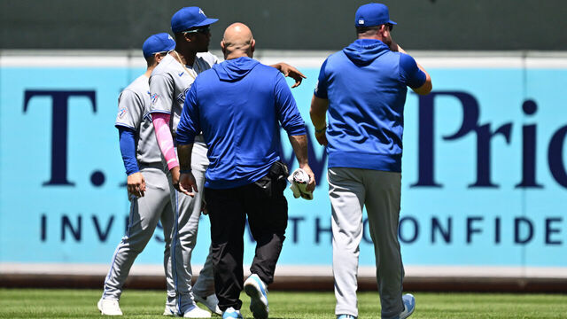 BALTIMORE, MD - MAY 31: Jesús Sánchez #12 of the Toronto Blue Jays points to where a ball thrown from the outfield stands struck him in the sixth inning against the Baltimore Orioles at Oriole Park at Camden Yards on May 31, 2026 in Baltimore, Maryland. Sánchez would leave the game after the incident.