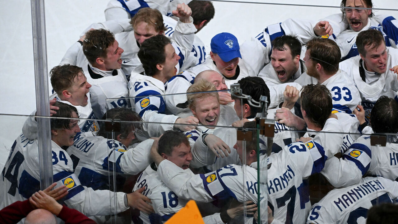Finland's forward #94 Konsta Helenius (C) celebrates with teammates after scoring the sudden-death goal to win during the over time of the IIHF Ice Hockey Men's World Championship final match between Switzerland and Finland at the Swiss Life Arena in Zurich on May 31, 2026.
