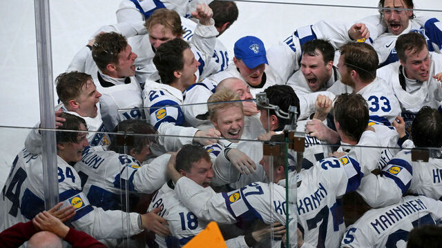 Finland's forward #94 Konsta Helenius (C) celebrates with teammates after scoring the sudden-death goal to win during the over time of the IIHF Ice Hockey Men's World Championship final match between Switzerland and Finland at the Swiss Life Arena in Zurich on May 31, 2026.