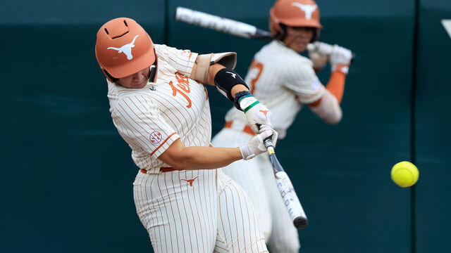 AUSTIN, TX - APRIL 12: Texas Longhorns utility Katie Stewart (20) gets a hit during the SEC college softball game between Texas Longhorns and Oklahoma Sooners on April 12, 2026, at Red & Charline McCombs Field in Austin, Texas.