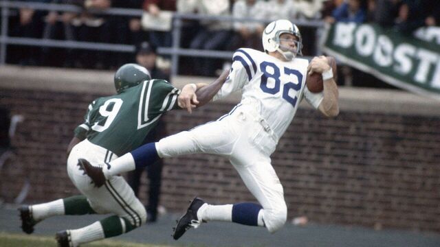 PHILADELPHIA, PA - CIRCA 1960's: Wide Receiver Raymond Berry #82 of the Baltimore Colts catches a pass over a Philadelphia Eagles defender during a circa 1960's NFL football game at Franklin Field in Philadelphia, Pennsylvania. Berry played for the Colts from 1955-67.