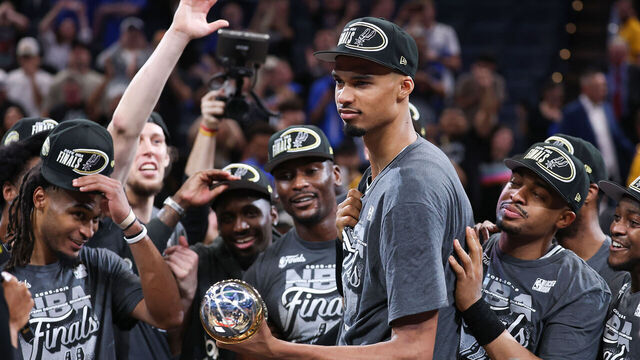 OKLAHOMA CITY, OKLAHOMA - MAY 30: Victor Wembanyama #1 of the San Antonio Spurs celebrates after being awarded the Earvin "Magic" Johnson MVP Trophy after defeating the Oklahoma City Thunder in Game Seven of the NBA Western Conference Finals at Paycom Center on May 30, 2026 in Oklahoma City, Oklahoma.
