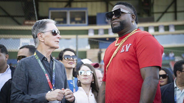 SANTO DOMNDO, DOMINICAN REPUBLIC - MARCH 9: Boston Red Sox Principal Owner John Henry talks with Former Boston Red Sox designated hitter David Ortiz before the 2024 Dominican Republic Series game against the Tampa Bay Rays as part of the MLB World Tour at Estadio Quisqueya on March 9, 2024 in Santo Domingo, Dominican Republic.