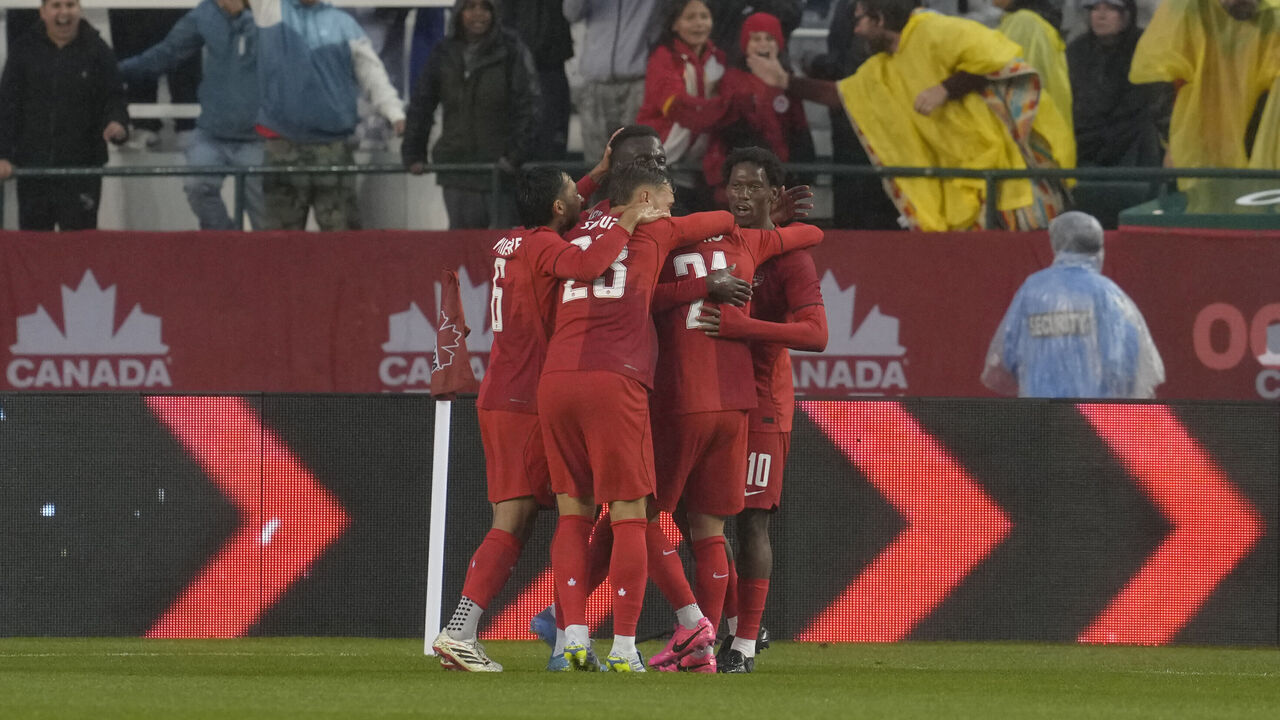 EDMONTON, ALBERTA - JUNE 01: Jonathan Osorio of Canada celebrates with teammates after scoring his team's first goal during the international friendly match between Canada and Uzbekistan at Commonwealth Stadium on June 01, 2026 in Edmonton, Alberta.