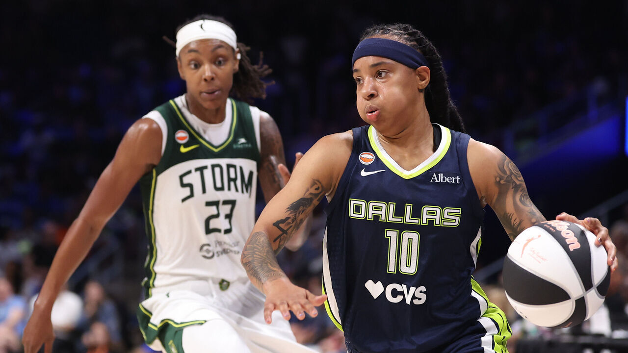 ARLINGTON, TEXAS - JUNE 01: Aziaha James #10 of the Dallas Wings controls the ball in front of Jordan Horston #23 of the Seattle Storm during the fourth quarter at College Park Center on June 01, 2026 in Arlington, Texas.