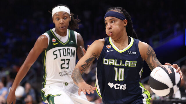 ARLINGTON, TEXAS - JUNE 01: Aziaha James #10 of the Dallas Wings controls the ball in front of Jordan Horston #23 of the Seattle Storm during the fourth quarter at College Park Center on June 01, 2026 in Arlington, Texas.