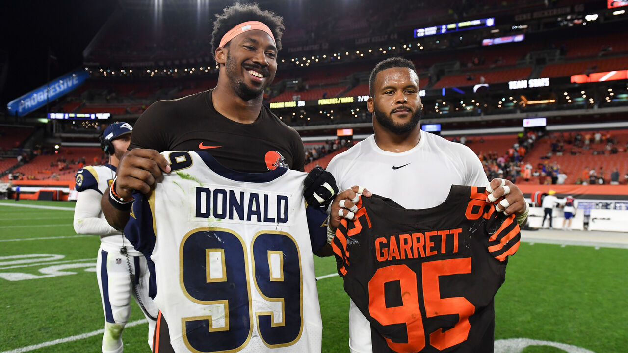 CLEVELAND, OH - SEPTEMBER 22, 2019: Defensive end Myles Garrett #95 of the Cleveland Browns and defensive tackle Aaron Donald #99 of the Los Angeles Rams pose for a picture as the trade jerseys after a game on September 22, 2019 at FirstEnergy Stadium in Cleveland, Ohio. Los Angeles won 20-13. (Photo by: 2019 Nick Cammett/Diamond Images via Getty Images)